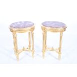 A PAIR OF CONTINENTAL GILTWOOD AND MARBLE LAMP TABLES each of oval outline surmounted by a rouge