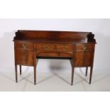 A 19TH CENTURY MAHOGANY SIDEBOARD of demilune outline the shaped top with moulded three quarter