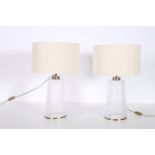 A PAIR OF GLAZED AND GILT METAL TABLE LAMPS each of cylindrical spreading form with shades 56cm (h)