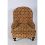 A 19TH CENTURY MAHOGANY UPHOLSTERED TUB SHAPED CHAIR the button upholstered back and seat on turned