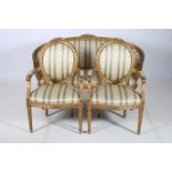 A 19TH CENTURY THREE PIECE FRENCH GILTWOOD SUITE comprising pair of salon chairs each with a