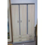 A CONTEMPORARY MELAMINE AND METAL THREE DOOR WARDROBE containing hanging rail and shelves the base
