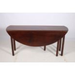 A GOOD GEORGIAN MAHOGANY DROP LEAF TABLE the oval hinged top raised on square moulded legs 72cm (h)