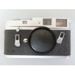 Leica M4 35mm rangefinder camera no. 1233655 with black hard leather case. No lens.