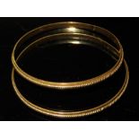Pair of 18ct gold Middle Eastern bangles 25. 6 g