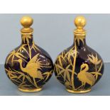 Pair of late 19thC Coalport porcelain small moon flasks with gilt decoration in relief of cranes and