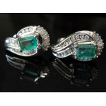14K white gold emerald and diamond ear studs with baguette and brilliant cut diamonds. Length 2.3