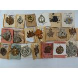 Twenty WWII British Army regimental cap badges