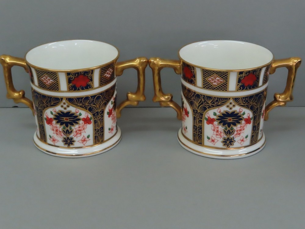A pair of Royal Crown Derby two handled cans with Old Imari decoration, ht 7.75 cm, pattern no.