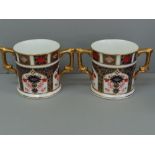 A pair of Royal Crown Derby two handled cans with Old Imari decoration, ht 7.75 cm, pattern no.