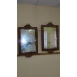 Pair of French style kingwood mahogany wall mirrors with gilt metal mounts , bows, swags and