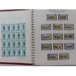 Stanley Gibbons Isle of Man stamp album - mint stamps, sheets, books from 1973 plus an empty album