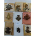 Nine WWI Irish regimental cap badges