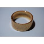 9ct. gold wide wedding band - 4.6 g - size L / M