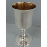 Irish silver goblet with slightly flared top, turned baluster column on stepped circular foot.