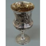 Victorian chased silver goblet with decoration of flowers, baluster column on circular foot with