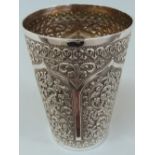 19thC Indian silver chased beaker with decoration of flora, fauna, scrolls and arches. Ht.