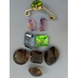Collection of cut semi-precious gem stones - amethyst, topaz, peridot, etc.