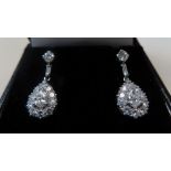 18ct white gold and diamond pear drop cluster ear studs. Ten diamonds surrounding, 0.25 ct pear drop
