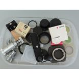 Collection of Leica / Leitz accessories - lens caps, handgrip, viewer lens, stand, Leica M - E