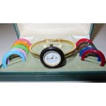 Lady's Gucci gold plated wind up wristwatch with interchangeable coloured bezels (boxed)