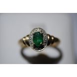 9ct. gold emerald and diamond ring - size N / O
