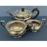 GV oval silver half fluted three piece tea service of good quality, London 1916, maker Goldsmiths
