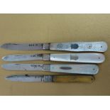 Four silver fruit knives, three with mother of pearl handles and one GIII with horn handle
