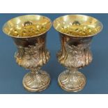 Pair of WIV chased silver goblets with flora, fauna and fluted decoration on raised circular