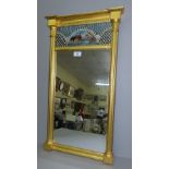 Regency style gilt frane wall mirror with painted glass panel to top. 69 x 36.5 cm
