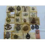 Twenty-one WWI / WWII Indian regimental cap badges