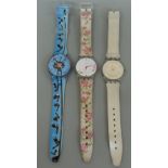 Three Swatch watches - two cased