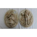 Pair of Meissen style oval porcelain plaques with decoration in relief of a lady with basket of