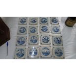 Sixteen 18thC style blue and white tiles with scenes of windmills. figures and landscape, 5 x 5