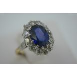 Oval sapphire and diamond cluster ring set in 18ct gold 9 (good colour sapphire), size J