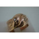 Early 20thC 9ct rose gold double snake head ring inset with two diamonds - Chester 1914 - size U / V