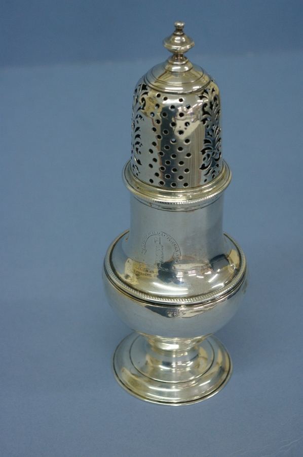 GIII silver sugar caster with turned finial, pierced dome top, belted baluster shaped body on raised