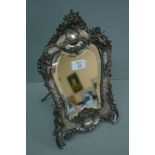 Edwardian silver plate on copper, bevel glass dressing table mirror with decoration of cherubs,