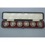 Set of six Edwardian silver buttons with shamrock decoration. Birmingham 1903. Maker H.M. (cased)
