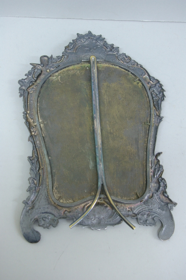 Edwardian silver plate on copper, bevel glass dressing table mirror with decoration of cherubs, - Image 2 of 2