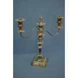 Loaded silver three branch candelabra with torch finial, reeded arms and foliate decoration to