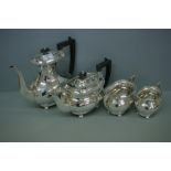 Four piece silver tea / coffee service of oval form with gadrooned border ebonised finials and