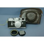 Leica M3 with bayonet-fit standard 50mm lens, UVa screw-on E39 Leitz filter attached, body dust cap,