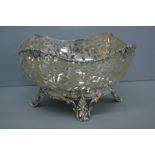 Victorian pierced silver fruit bowl with foliate decoration, cotton reel borders on splayed feet.