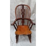 Good quality Victorian yew wood comb back Windsor rocking chair matching lot 219. Ht. 42 ins., width