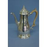 Georgian style silver coffee pot of plain baluster form with fruit wood handle. London 1968. 32 ozt.