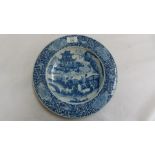 19thC Chinese blue and white dish with decoration of bats, flowers, figures by a bridge and dragon