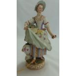 19thC Meissen porcelain figure of the flower seller - Ht. 7.75 ins., crossed swords in underglaze