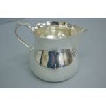 1980 heavy silver cream jug of plain form. London 12.5 ozt. Maker E.B.