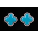 Pair of 14 kt. White Gold, Blue Quatrefoil and Diamond Earrings , center x-shape gem set within pave